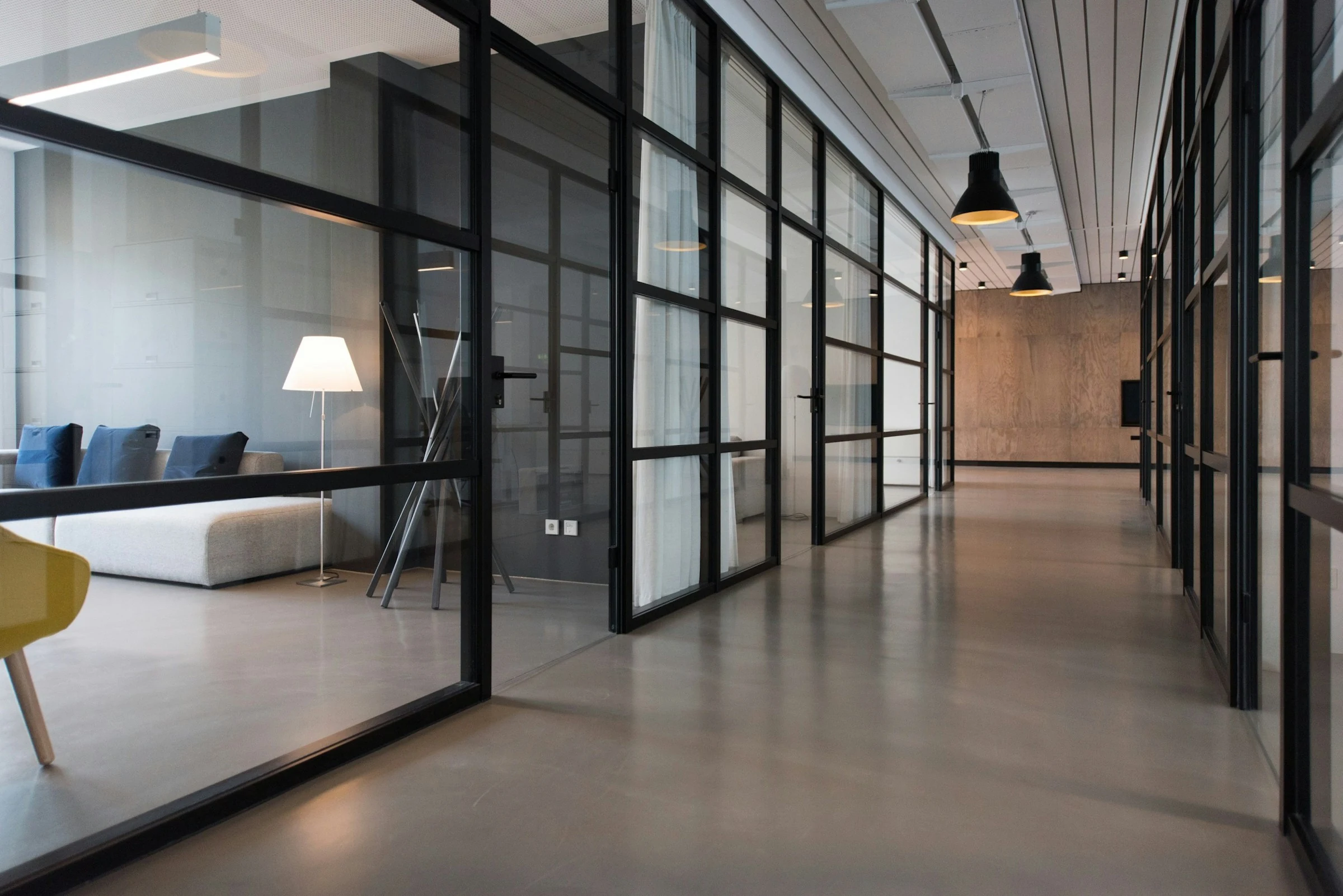 Contemporary office with glass meeting rooms