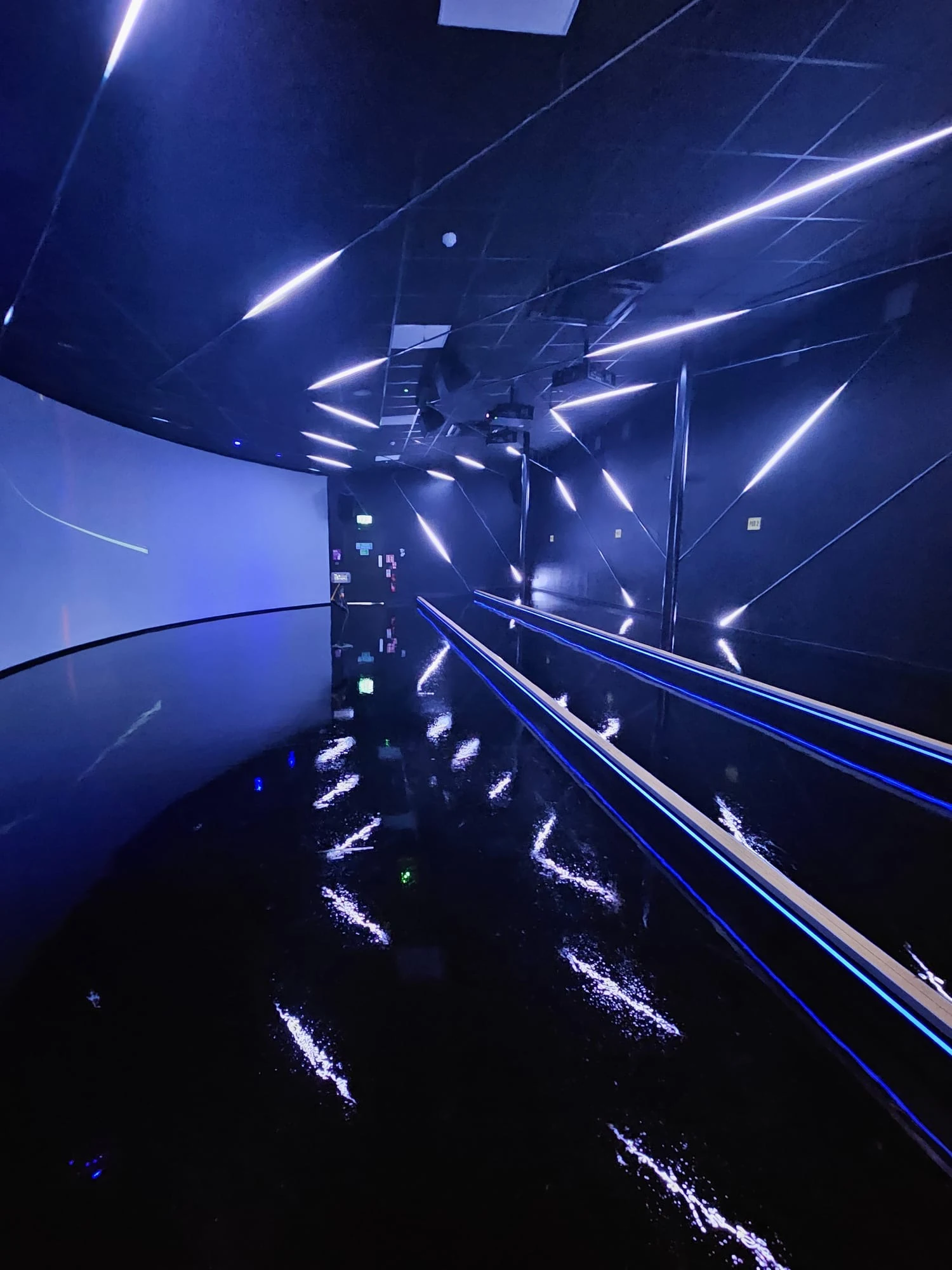 Violet-lit completed West Wood Club interior
